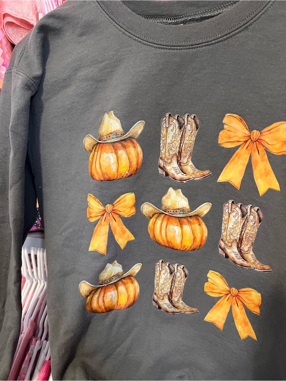 Women’s Black Pullover Sweatshirt with Orange Pumpkin & Bow Graphic - Picture 2 of 4